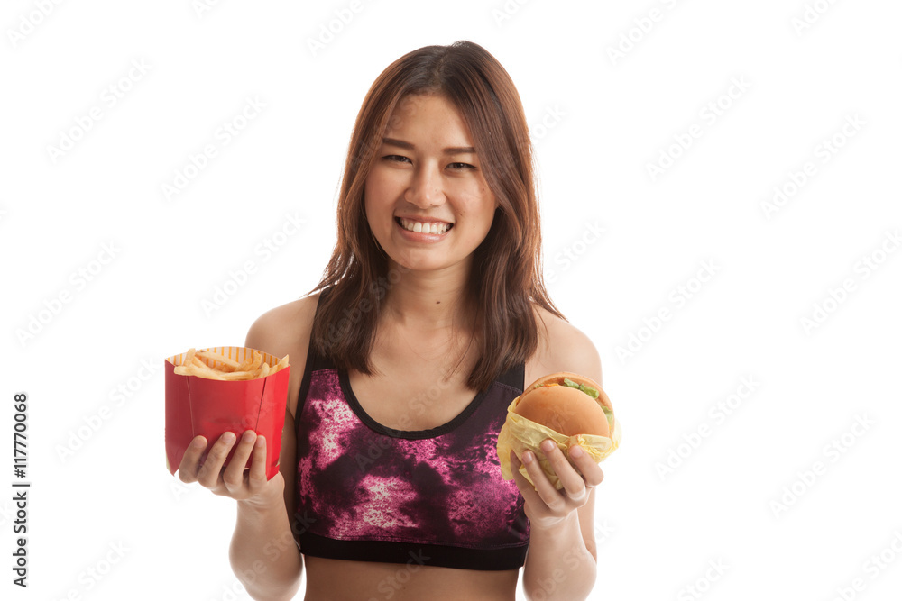 Beautiful Asian healthy girl with french fries and hamburger. Beautiful Asian healthy girl with french fries and hamburger.
