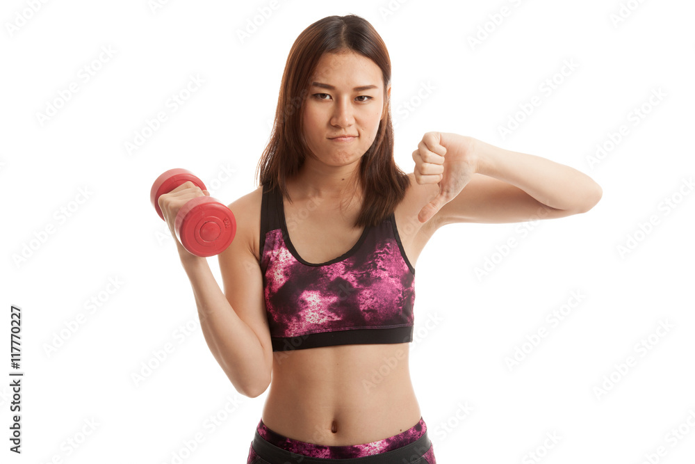 Beautiful Asian healthy girl thumbs down with dumbbell. Beautiful Asian healthy girl thumbs down with dumbbell.
