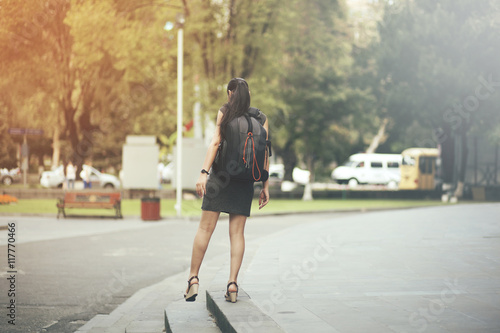 woman backpack walks