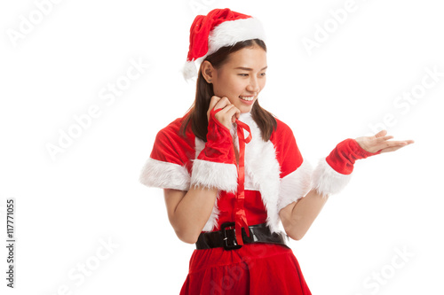 Asian Christmas Santa Claus girl present space on her hand.