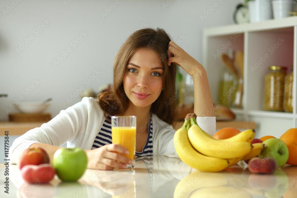 Portrait of a pretty woman holding glass with tasty juice Portrait of a pretty woman holding glass with tasty juice