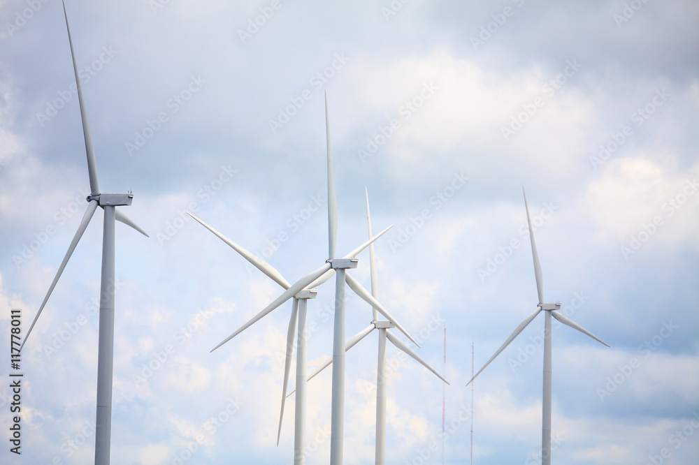 Fototapeta premium Wind turbines with the clouds and sky