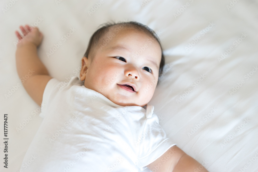 Portrait of a newborn Asian baby on the bed Portrait of a newborn Asian baby on the bed