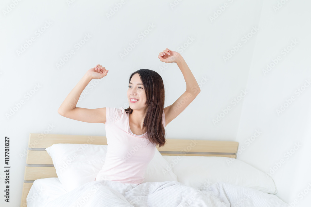 Woman waking up on bed Woman waking up on bed