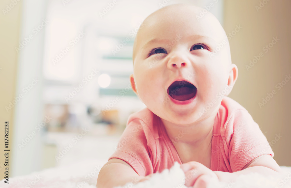 Happy newborn baby girl smiling Happy newborn baby girl smiling