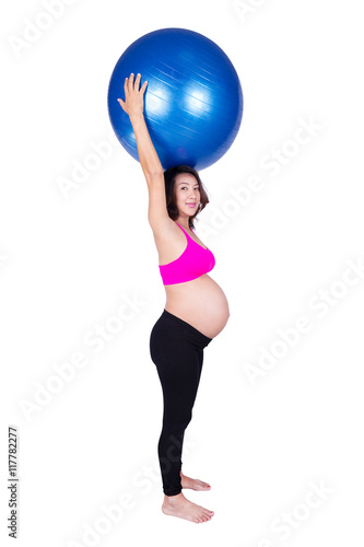 Pregnant woman with fitness ball on white background