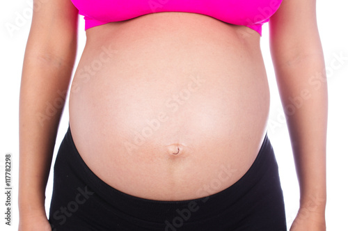 Wallpaper Mural Close-up of pregnant woman belly isolated on white Torontodigital.ca