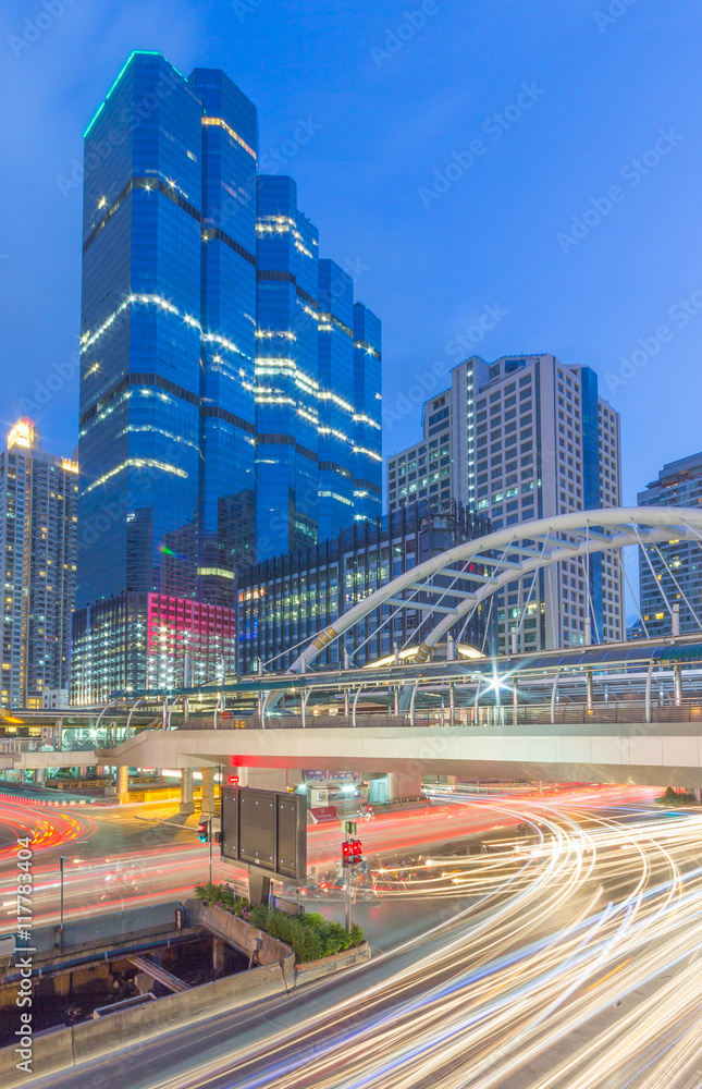 Fototapeta premium Bangkok,Thailand - 28 June 2014: Night time at Chong Nonsi skywalk Bangkok skytrain station (BTS) in Bangkok, Thailand. Chong Nonsi Station is a skytrain station at Bang Rak District.