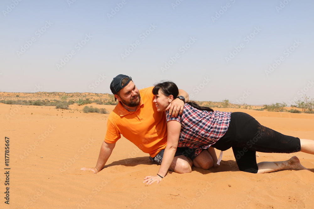 Man and woman are having fun in the desert