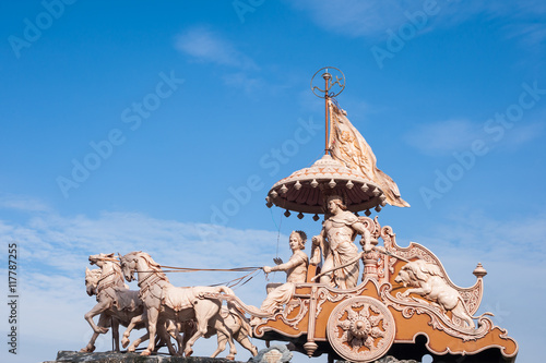 A statue of the Hindu god Krishna and his devotee Arjuna at Rishikesh, North India. photo