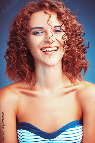 Beautiful portrait curly girl model with makeup and a pretty smile © nalliens