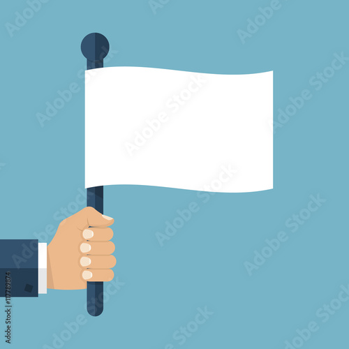 Hand holding white flag