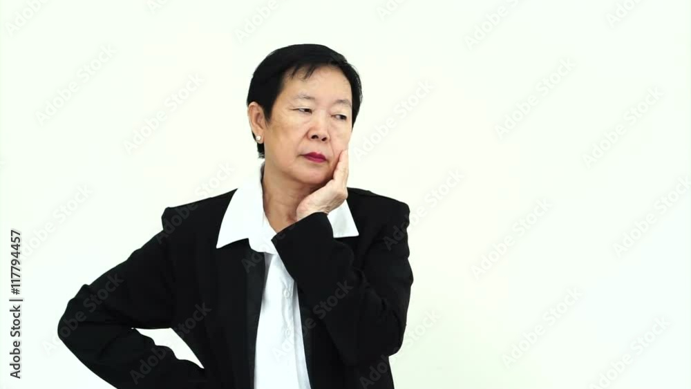 Asian senior businesswoman thinking serious about business and unhappy Asian senior businesswoman thinking serious about business and unhappy