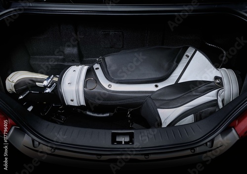 Golf bag and gas tank in car trunk, showing enough space.   © creativesunday