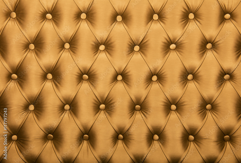 Fototapeta premium Golden capitone tufted fabric upholstery texture
