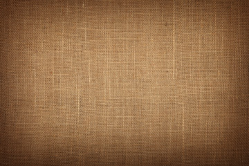 Brown burlap jute canvas background with shade