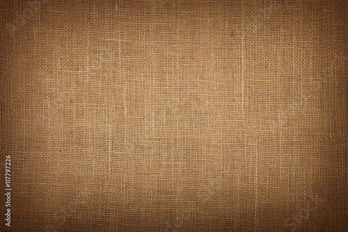 Brown burlap jute canvas background with shade