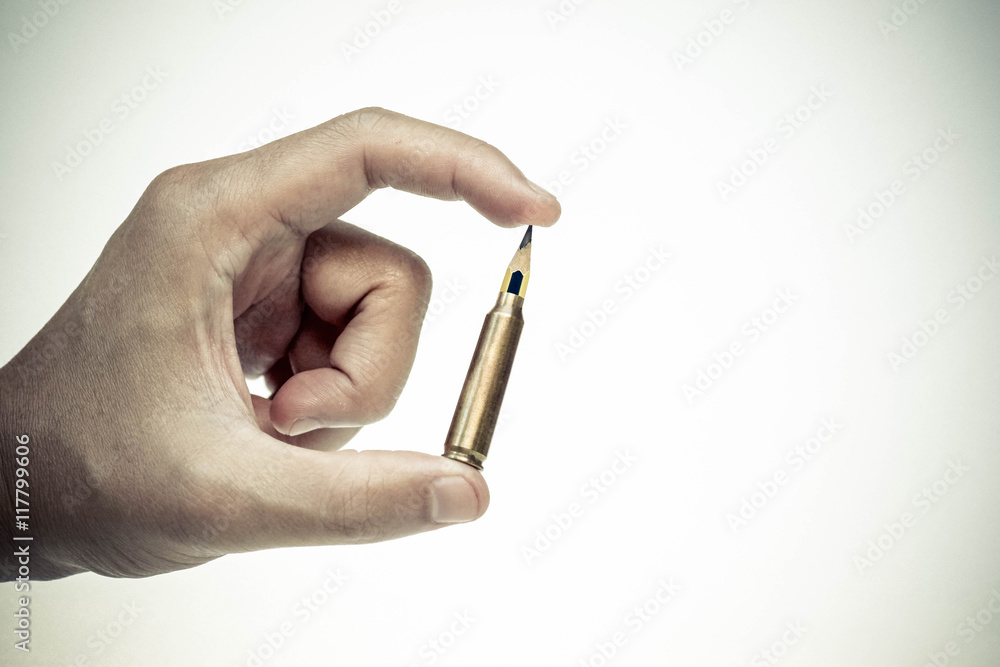 A rifle bullet with a pencil at the head / Using idea as weapon concept A rifle bullet with a pencil at the head / Using idea as weapon concept