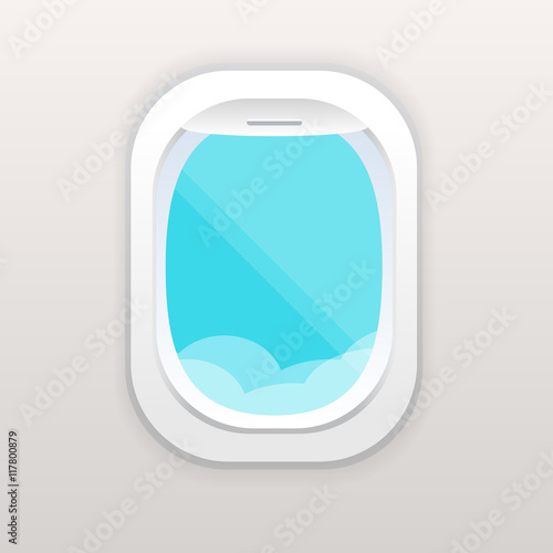 Aircraft window with cloudy blue sky outside