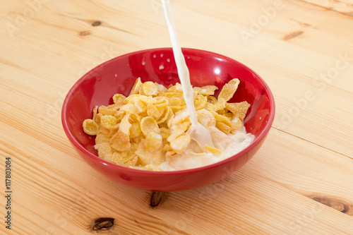 A bowl of Corn flakes with milk.