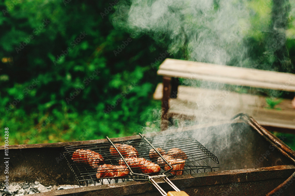 delicious grilled sausages roasting on grates with flames and sm delicious grilled sausages roasting on grates with flames and sm