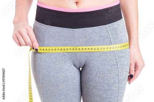 Foto Close-up of female measuring booty line