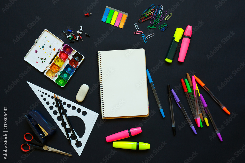 School supplies on blackboard background School supplies on blackboard background