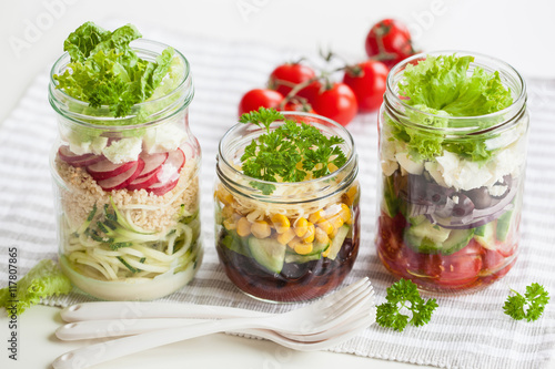 healthy vegetable cheese salad in mason jars