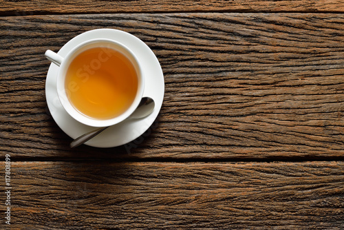 Top view of a cup of tea on wooden table