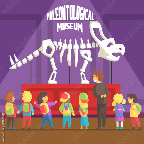 Groop Of School Kids In Paleontology Museum Next To Triceratops Skeleton