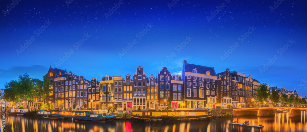 Fototapeta premium Amstel river, canals and night view of beautiful Amsterdam city. Netherlands
