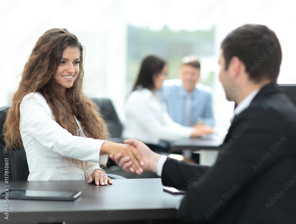 Business people shaking hands, finishing up a meeting Business people shaking hands, finishing up a meeting