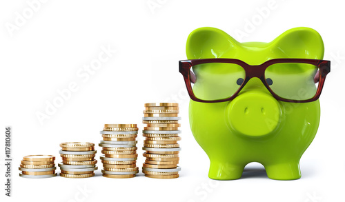 Green piggy bank with glasses and coin stacks in ascending order