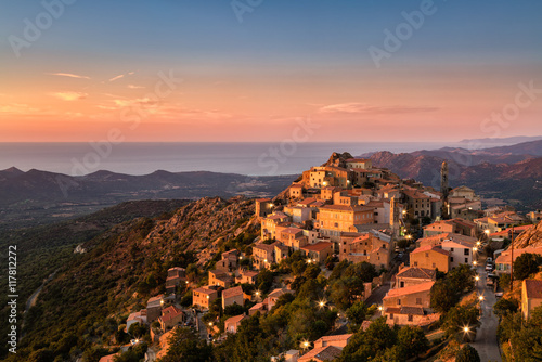 Late evening sunshine on mountain village of Speloncato in Corsi photo