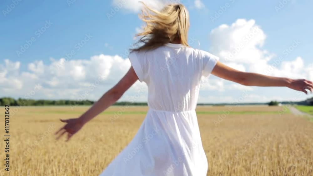 smiling young woman in white dress on cereal field smiling young woman in white dress on cereal field