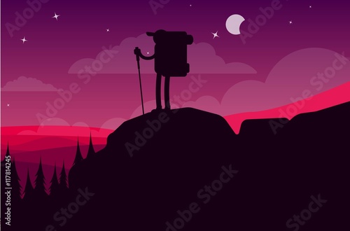 Fototapeta Naklejka Na Ścianę i Meble -  Traveler stands on the top of a mountain in the night sky.