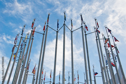 Obraz na płótnie flags of different countries on background of sky with clouds w salonie