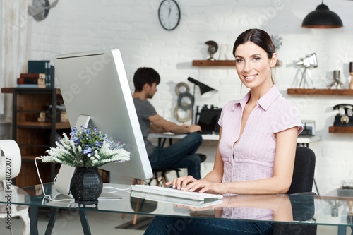 Happy woman working with computer