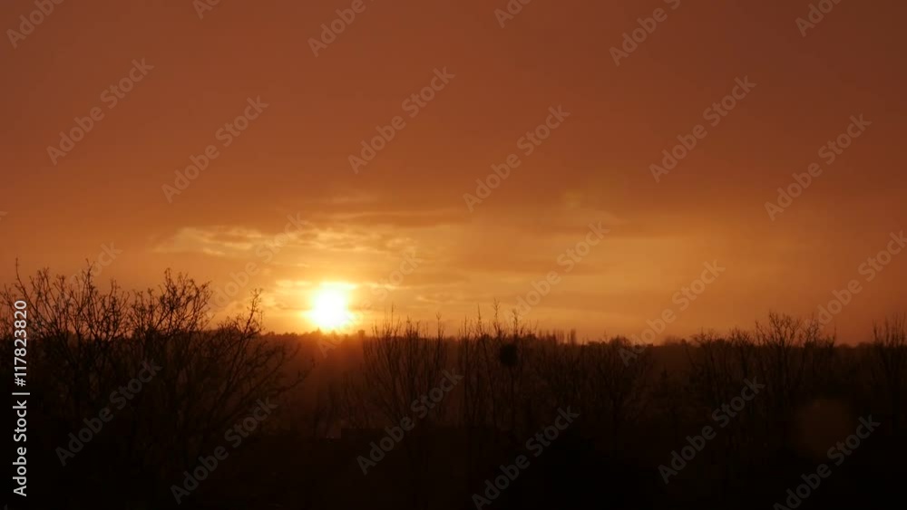 Red sky over hot sun with over northern Europe city while rain is falling in slow motion 1080p FullHD footage - Strange sun shining while raindrops are falling 1920X1080 slow-mo video 