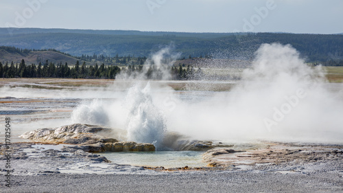 Erupting geyser with steam. Fountain Paint Pots. Yellowstone National Park, Wyoming