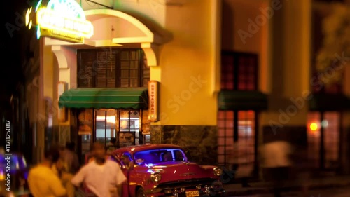 bar and street scene in havana cuba at night photo