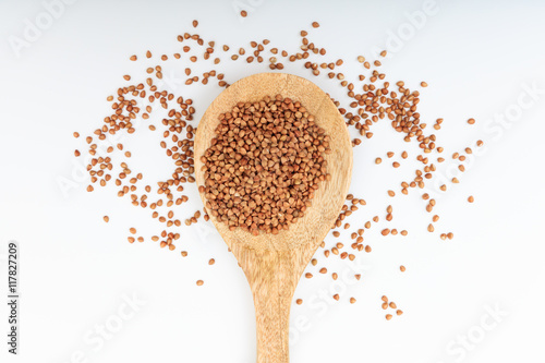 Buckwheat in a wooden spoon