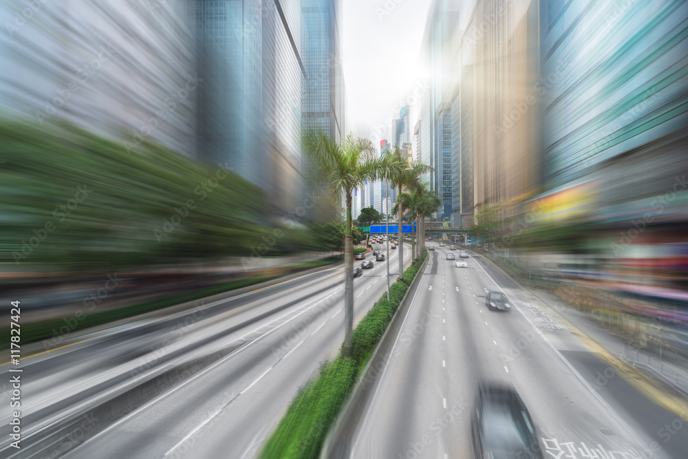 blurred traffic in downtown district,hong kong,china.Chinese characters on road are all traffic roadmarking. blurred traffic in downtown district,hong kong,china.Chinese characters on road are all traffic roadmarking.