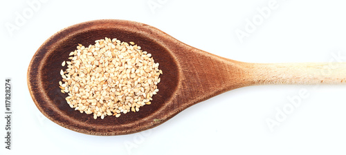 Raw sesame in a wooden spoon