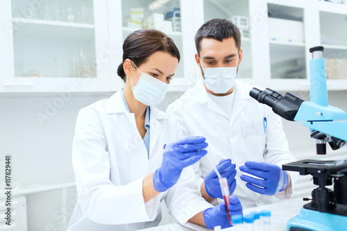 young scientists making test or research in lab