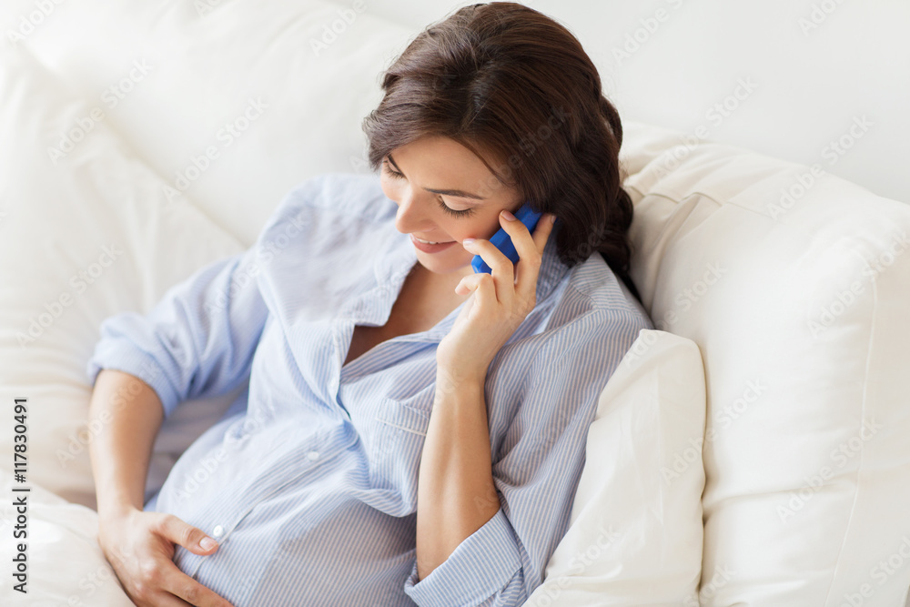happy pregnant woman calling on smartphone at home happy pregnant woman calling on smartphone at home