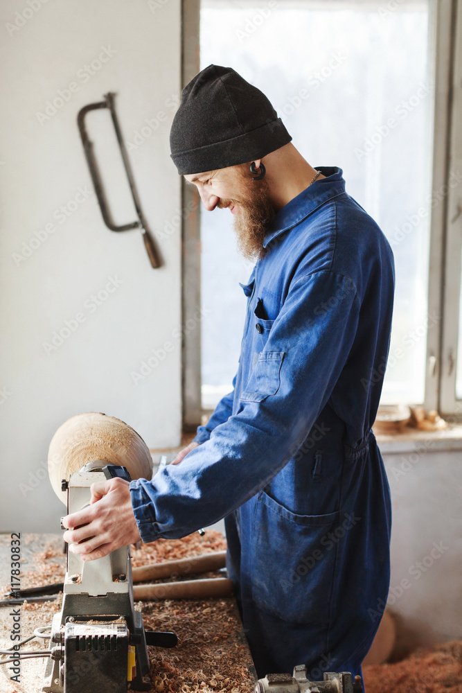 A man working with woodcarving instruments A man working with woodcarving instruments