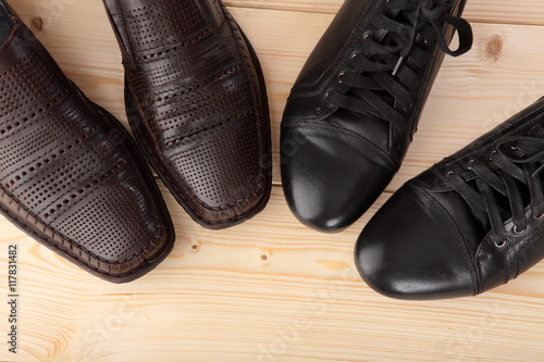 Men's shoes on a wooden floor. Close-up