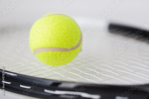 close up of tennis racket with ball © Syda Productions