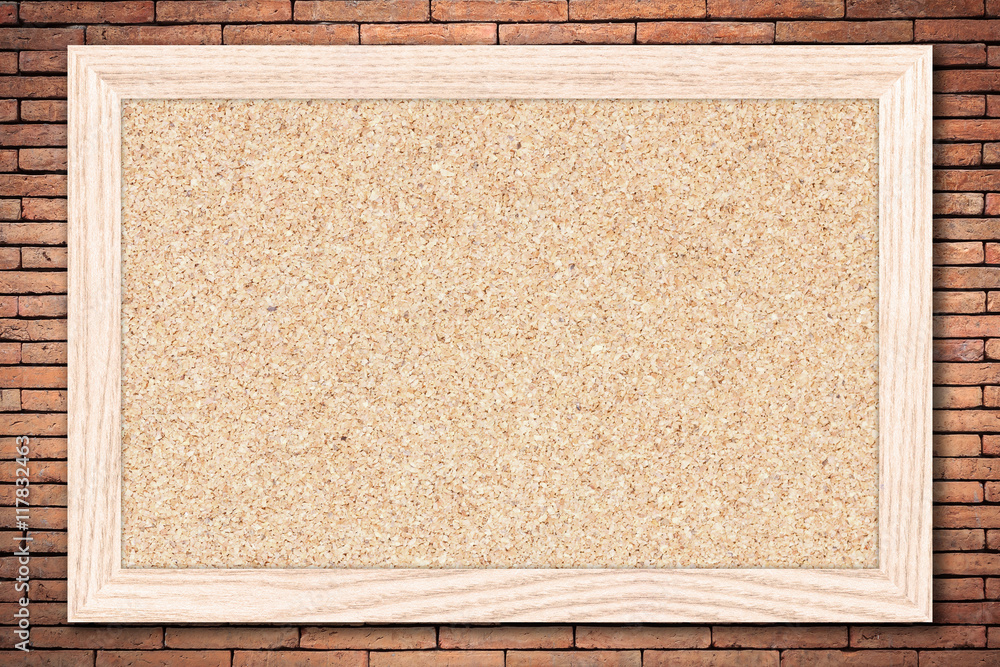 Cork Board Or Empty Bulletin Board With A Wooden Frame On Brick Wall cork-board-or-empty-bulletin-board-with-a-wooden-frame-on-brick-wall